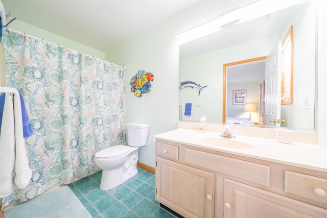 bathroom featuring toilet and vanity