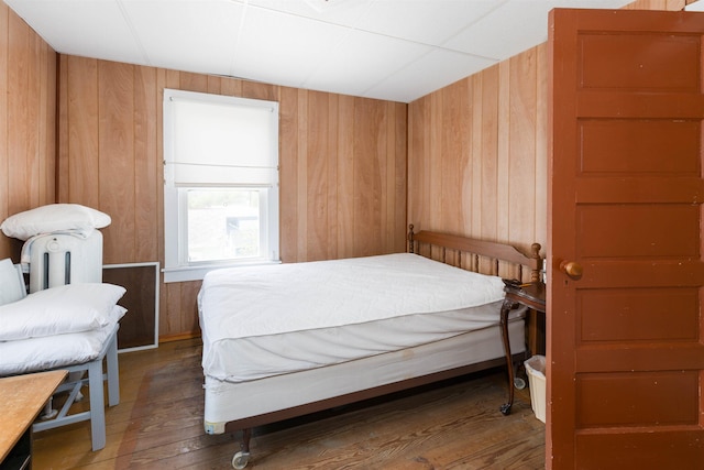 112 E Montgomery Ave, Wildwood, NJ 08260 - bedroom with wooden walls and hardwood / wood-style floors