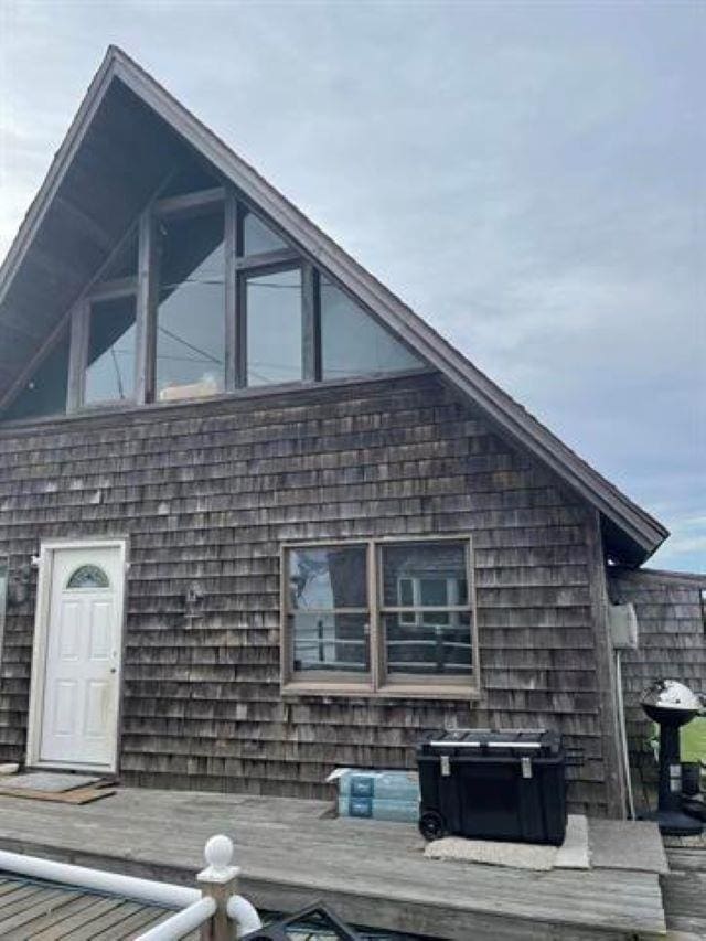 view of side of home with a deck