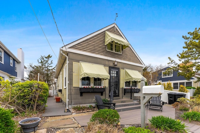 view of front of property with a wooden deck