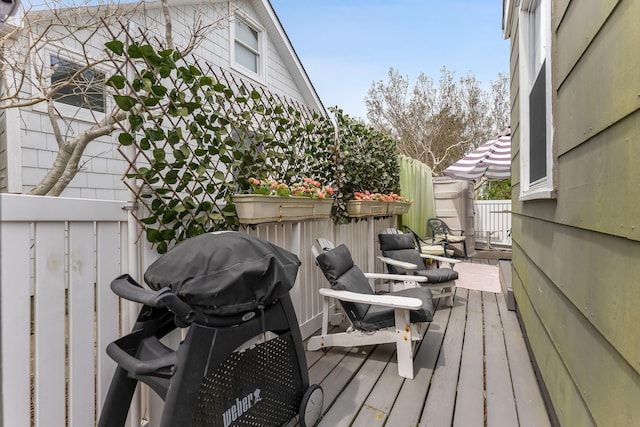 deck featuring a grill