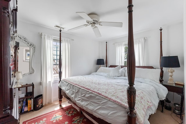 bedroom featuring visible vents, a ceiling fan, carpet, and multiple windows