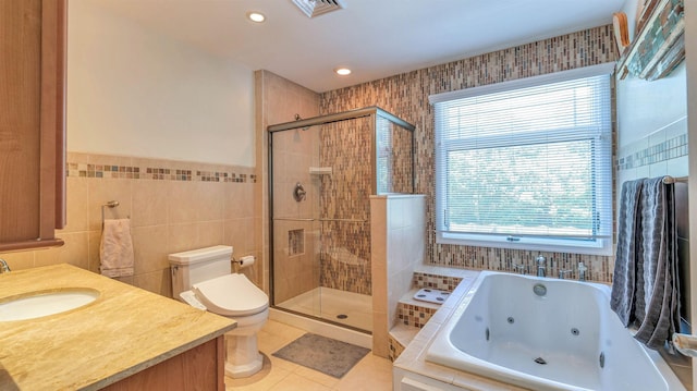 13 Mooring Cir, Seaville, NJ 08230 - bathroom featuring a whirlpool tub, a stall shower, tile walls, tile patterned floors, and vanity