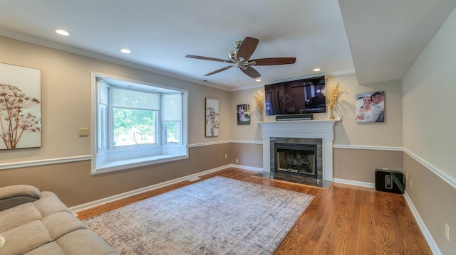 13 Mooring Cir, Seaville, NJ 08230 - living room with a premium fireplace, wood finished floors, crown molding, a ceiling fan, and recessed lighting