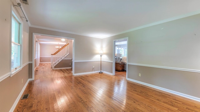 13 Mooring Cir, Seaville, NJ 08230 - empty room featuring a chandelier, plenty of natural light, wood finished floors, stairs, and ornamental molding
