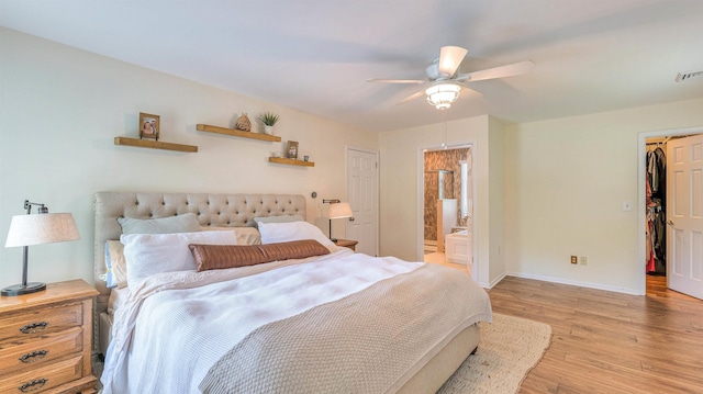 13 Mooring Cir, Seaville, NJ 08230 - bedroom with light wood-style flooring, connected bathroom, a ceiling fan, a spacious closet, and a closet