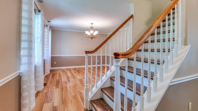 13 Mooring Cir, Seaville, NJ 08230 - stairway with wood finished floors, a chandelier, and crown molding