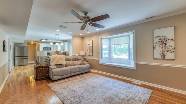 13 Mooring Cir, Seaville, NJ 08230 - living area featuring light wood-type flooring, a ceiling fan, ornamental molding, and recessed lighting