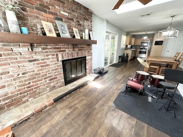 49 Hope Corson Rd, Ocean View, NJ 08230 - living area featuring dark wood-style floors, a ceiling fan, and a brick fireplace