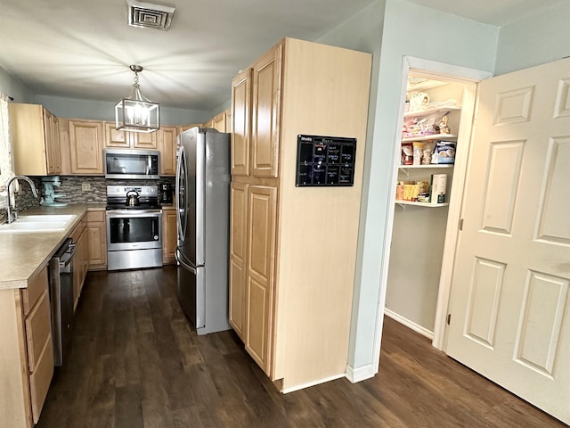 49 Hope Corson Rd, Ocean View, NJ 08230 - kitchen featuring stainless steel appliances, light brown cabinets, a sink, and dark wood-style flooring