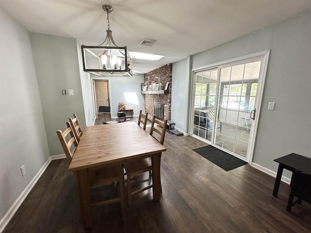 49 Hope Corson Rd, Ocean View, NJ 08230 - dining space featuring a chandelier, dark wood finished floors, baseboards, and a fireplace