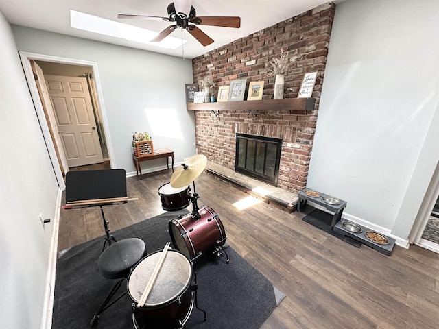 49 Hope Corson Rd, Ocean View, NJ 08230 - living room featuring ceiling fan, wood finished floors, a brick fireplace, and baseboards