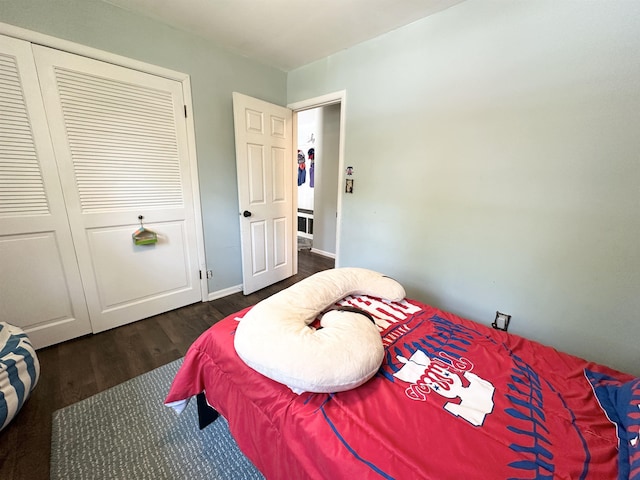 49 Hope Corson Rd, Ocean View, NJ 08230 - bedroom featuring dark wood finished floors, a closet, and baseboards