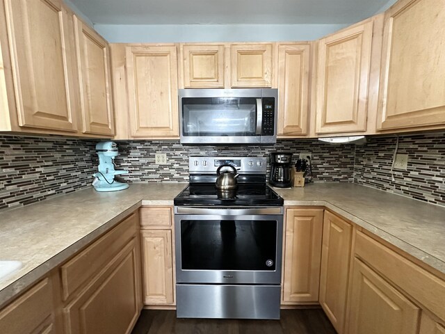 49 Hope Corson Rd, Ocean View, NJ 08230 - kitchen featuring stainless steel appliances, light brown cabinetry, and backsplash