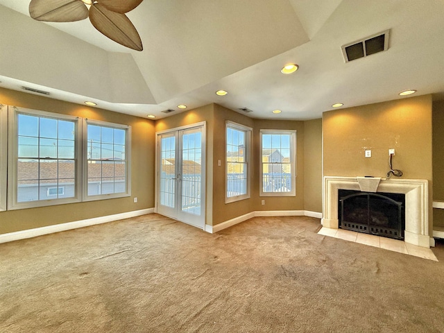 unfurnished living room with carpet flooring and ceiling fan