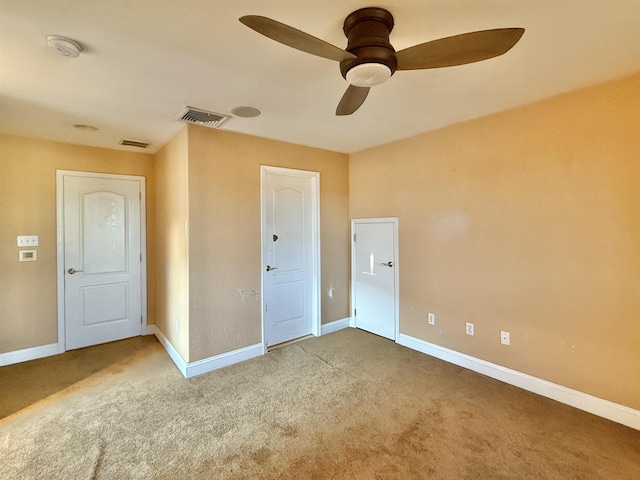 unfurnished bedroom with carpet and ceiling fan