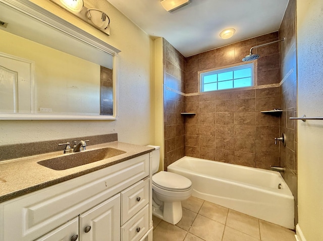 full bathroom with toilet, vanity, tiled shower / bath combo, and tile patterned floors