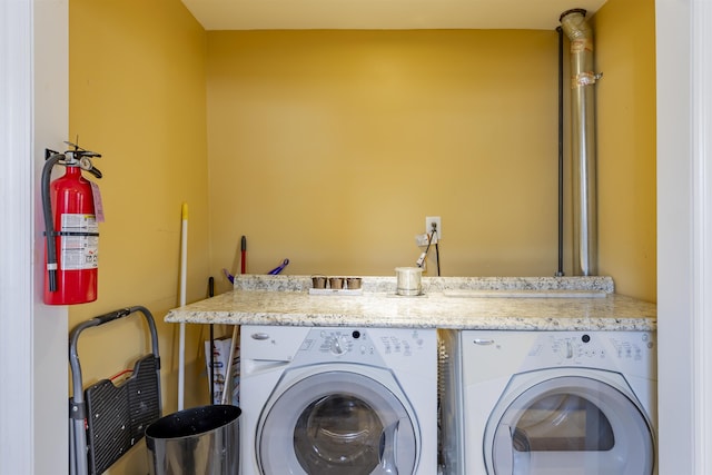 clothes washing area with laundry area and independent washer and dryer