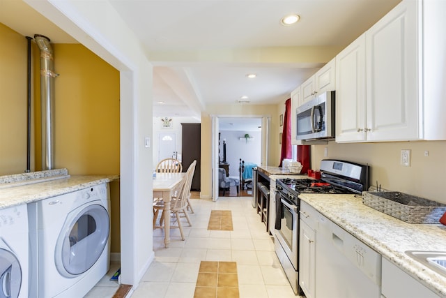 kitchen with light tile patterned floors, stainless steel appliances, recessed lighting, white cabinetry, and light stone countertops