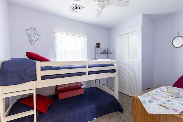 bedroom featuring ceiling fan, carpet floors, a closet, and visible vents