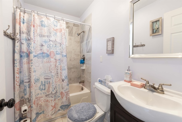 bathroom featuring toilet, shower / bath combo with shower curtain, and vanity