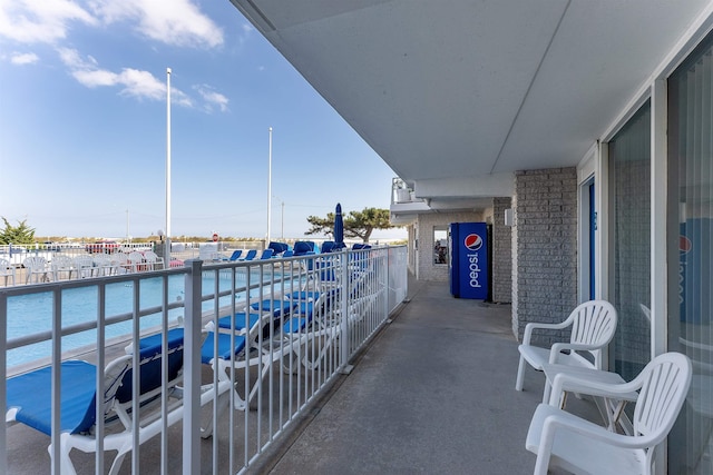 balcony featuring a water view