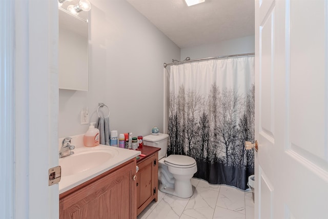 bathroom with vanity, a shower with shower curtain, toilet, and marble finish floor