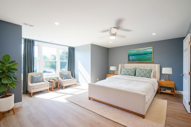 bedroom featuring light wood finished floors, recessed lighting, visible vents, ceiling fan, and baseboards