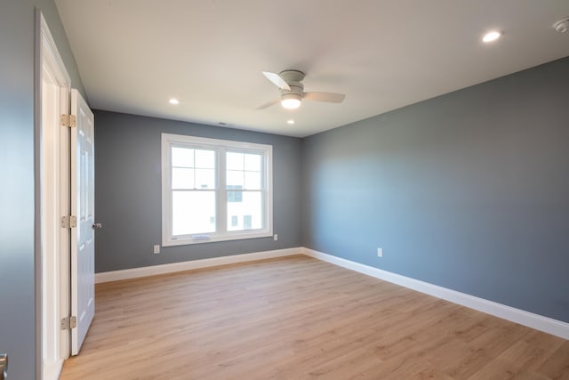 spare room with light wood-style floors, baseboards, a ceiling fan, and recessed lighting