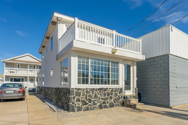 view of side of property with entry steps