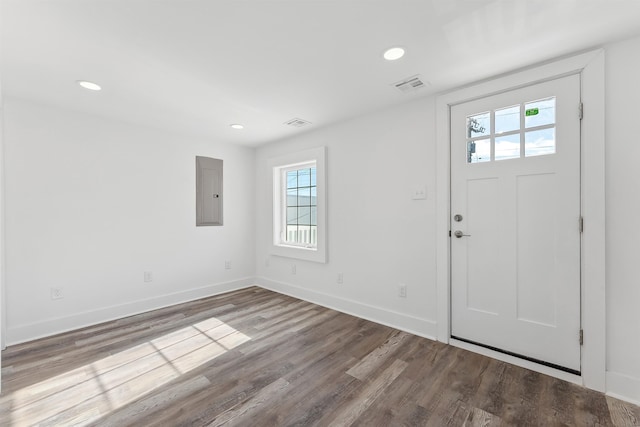 entrance foyer with electric panel, baseboards, visible vents, wood finished floors, and recessed lighting