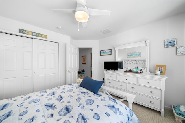 bedroom with ceiling fan, a closet, and carpet floors