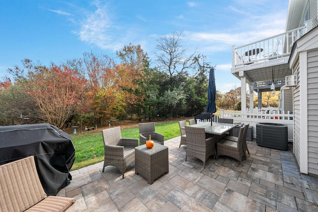 view of patio with a balcony, grilling area, and central AC