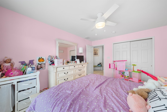 bedroom with ceiling fan and a closet