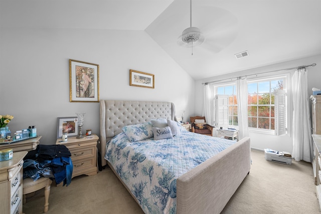 bedroom with light colored carpet, vaulted ceiling, and ceiling fan