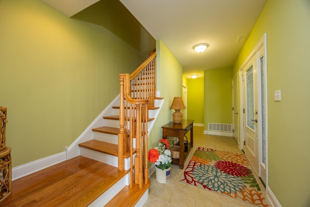 interior space with french doors and light tile patterned floors