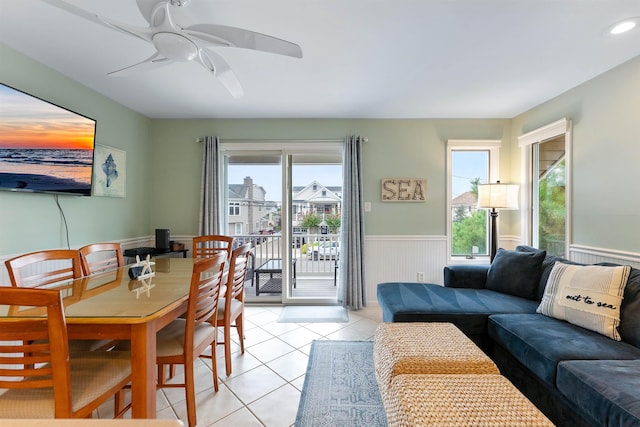 dining space featuring light tile patterned flooring and ceiling fan