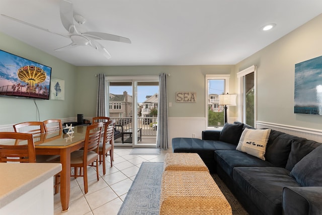 tiled living room featuring ceiling fan