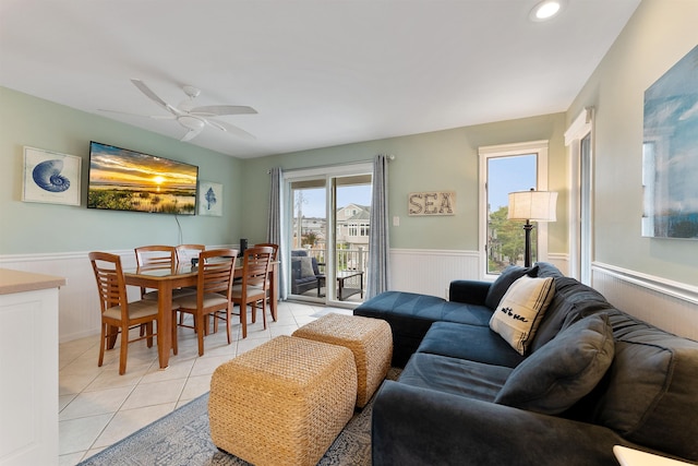 tiled living room featuring ceiling fan