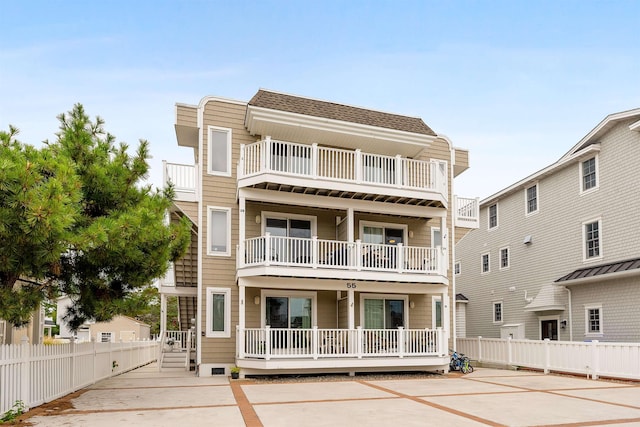 view of front of house with a balcony