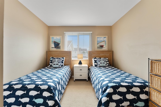 bedroom featuring light carpet