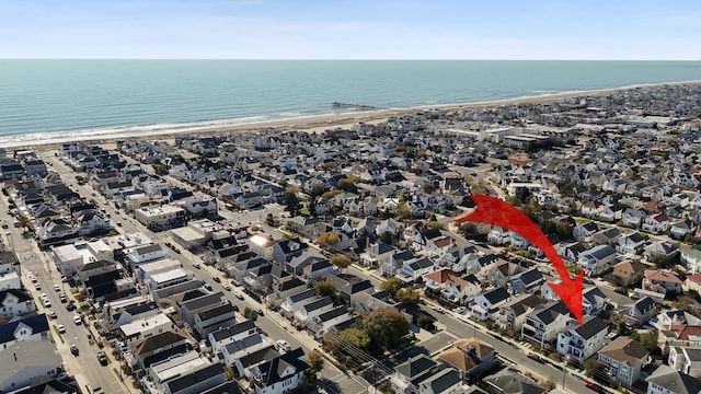 aerial view with a beach view and a water view