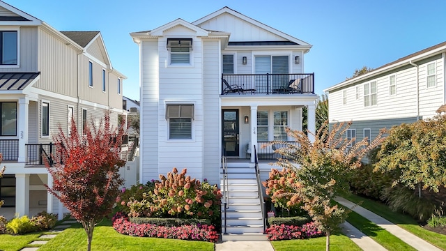 view of front of property with a porch and a balcony