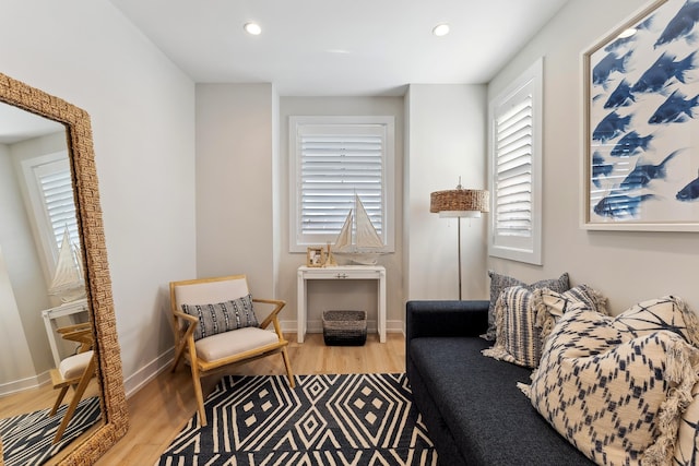 sitting room with hardwood / wood-style flooring