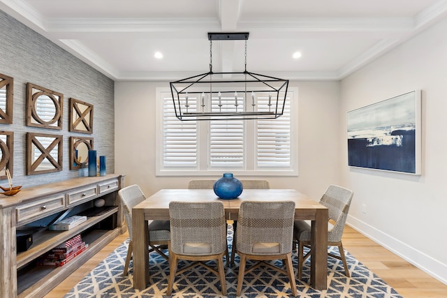 dining room with beamed ceiling, light hardwood / wood-style floors, ornamental molding, and coffered ceiling