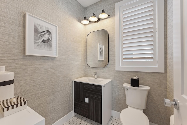 bathroom featuring tile patterned flooring, vanity, and toilet