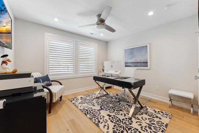 office space featuring light hardwood / wood-style flooring and ceiling fan