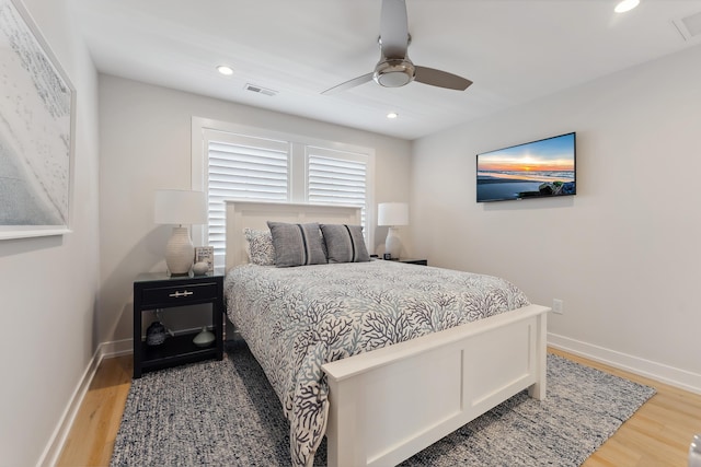 bedroom featuring wood-type flooring and ceiling fan