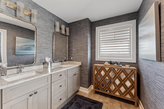 bathroom featuring hardwood / wood-style flooring and vanity