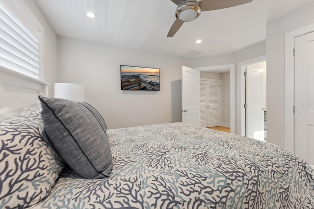 bedroom with ceiling fan and a closet